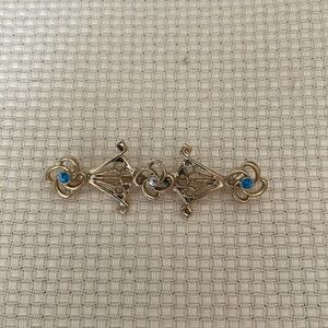 Gold Brooch with clear and blue stones